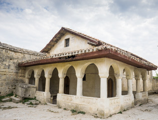 Fototapeta na wymiar Reconstructed Karaim kenasa in medieval cave town Chufut-Kale.