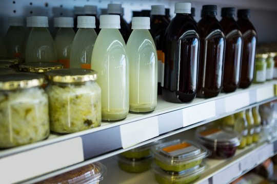 Variety of healthy juices and jars  - Powered by Adobe