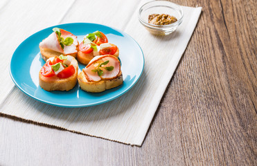 Bruschetta with tomato, cheese and bacon