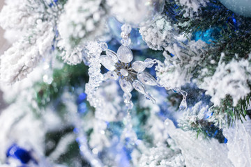 Christmas decoration glass snowflake on a  tree