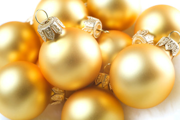 golden christmas balls on snow