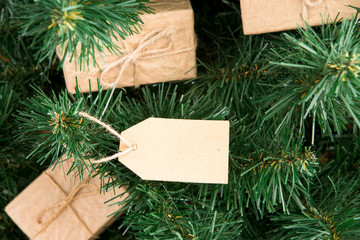 Gift boxes and tag on christmas tree