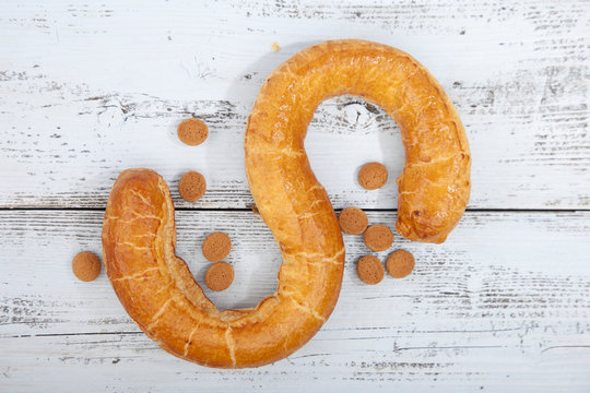 Traditional Dutch cookie Banketletter at Sinterklaas celebration on wooden background