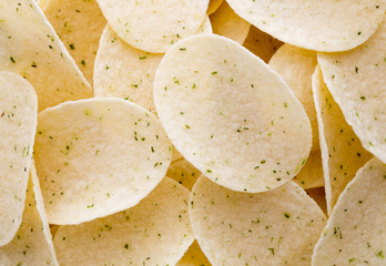 Close up potato chips on wood top view background.