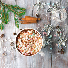 Big Cup of hot Chocolate drink with Marshmallows and cinnamon on white wooden background. Winter time. Holiday concept, Top view