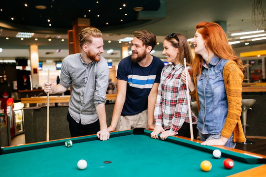 Group of people playing snooker