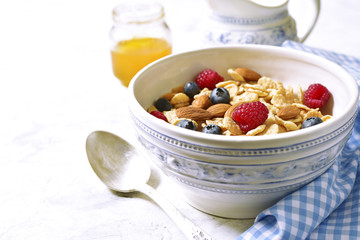 Muesli with fresh ripe berries for a breakfast.