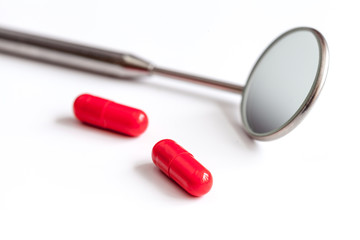 concept tooth pain - dentist tools, tablet at white background