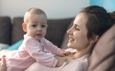 mother playing with her baby