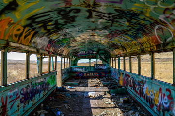 Inside of abandoned graffiti bus.