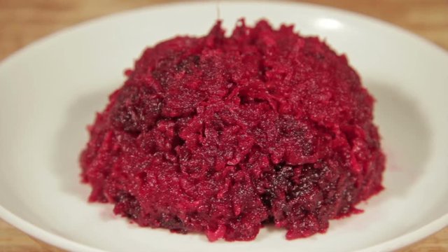 Grated homemade salad of beetroot close up