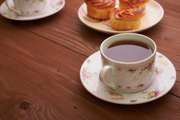 tea and sweets on a wooden table