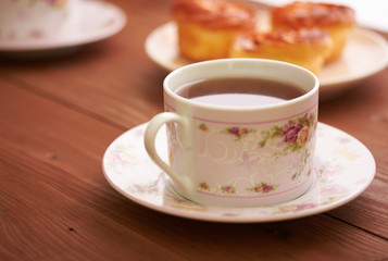 tea and sweets on a wooden table