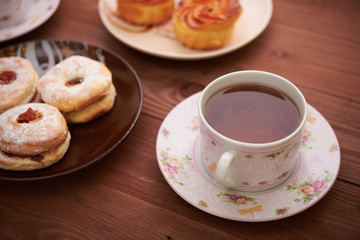 tea and sweets on a wooden table