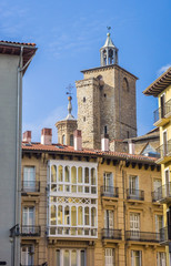 Fototapeta na wymiar Church tower and apartment buildings in the center of Pamplona