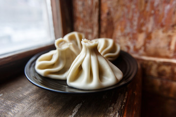 Traditional Georgian food khinkali. Minced meat with spices wrap