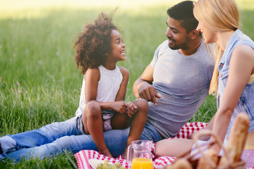 Happy family enjoying picnic