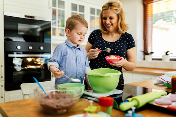 Beautiful child and mother baking
