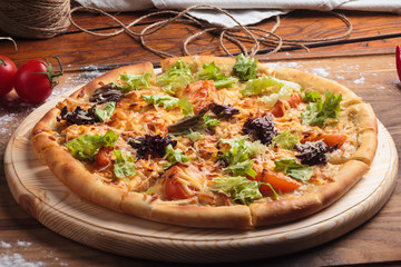 Concept: restaurant menus, healthy eating, homemade, gourmands, gluttony. Caesar pizza on messy...
