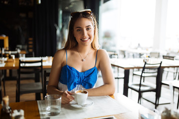 Stunning woman enjoying her coffee