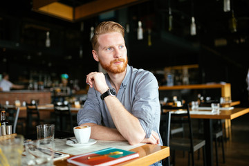 Serious man drinking coffee