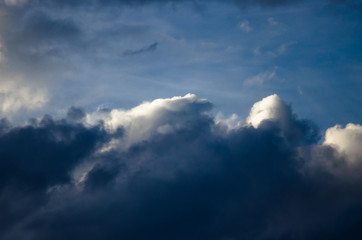 Fototapeta na wymiar Dark Storm Clouds Boiling in the Dark Evening Sky