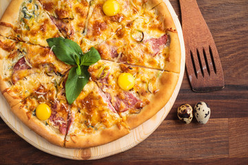 Concept: restaurant menus, healthy eating, homemade, gourmands, gluttony. Pizza carbonara on a wooden vintage table with ingredients. Top-down view