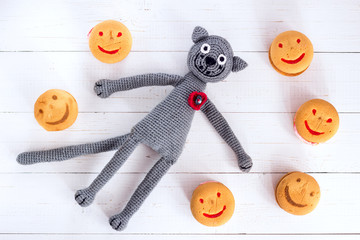 Handmade crochet cat toy with macarons.