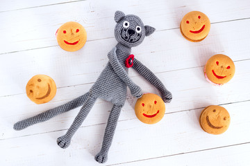 Handmade crochet cat toy with macarons.