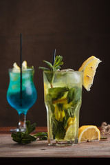 Concept: restaurant menus, healthy eating, homemade, gourmands, gluttony. Mojito Cocktail on gritty vintage background.