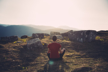 Practicing yoga in nature. Active living concept. Taking care of your health. Reducing stress by exercising.Mindfulness.Body and soul harmony,yin and yang concept.Balancing turmoil in life