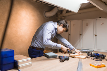 Joiner working and designing on workbench