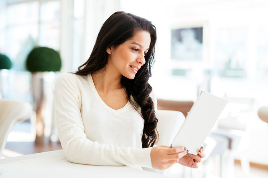 Beautiful Woman Looking At Menu