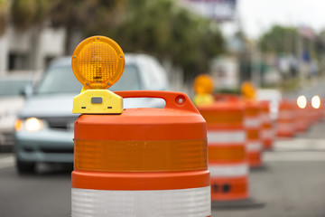 Road closed signs detour traffic temporary barrel arrow light