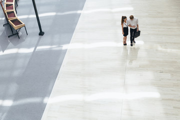 Business couple walking together