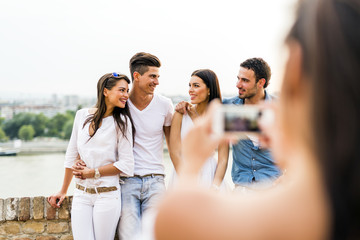 Group of young people being photographed
