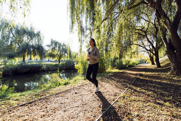 Fit female jogger running in nature