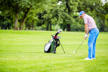 Golfer practicing and concentrating before and after shot