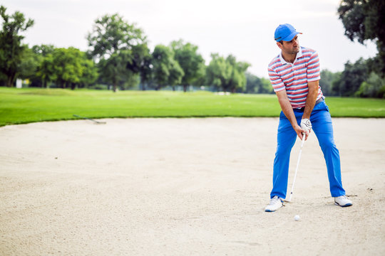 Golfer Taking A Bunker Shot