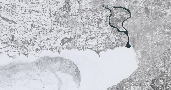 High-altitude overflight aerial of a frozen Erie, Ontario. Clip loops and is reversible. Elements of this image furnished by USGS/NASA Landsat 