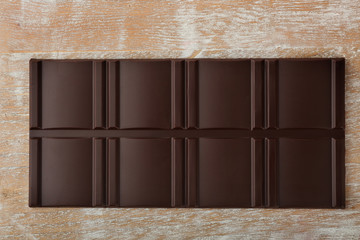 Chocolate bar on wooden background