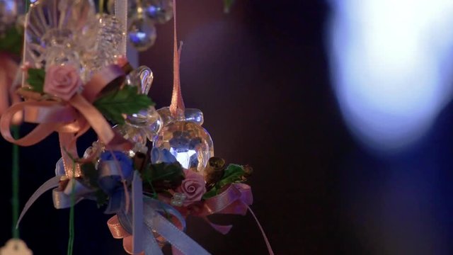 Christmas ornaments hanging in market stall
