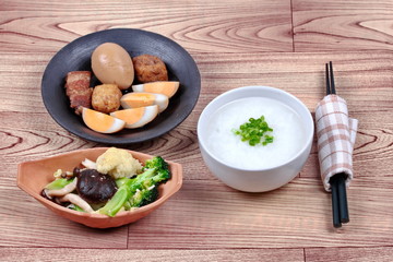 Rice gruel and stewed boiled egg  and fried vegetables.