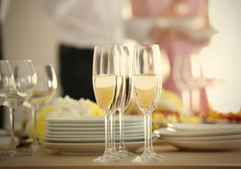 Glasses of champagne on table served for buffet catering party, close up