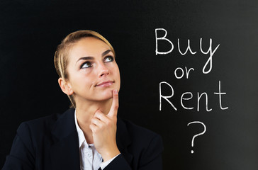 Businesswoman Thinking To Choose Buy Or Rent