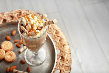 Delicious milkshake on metal tray closeup