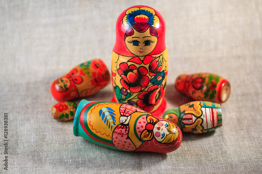 Wall mural Russian dolls. Matryoshka on linen fabric for the background.