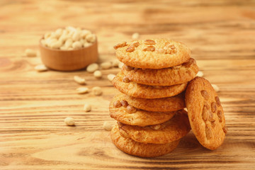 Tasty peanut cookies on wooden background