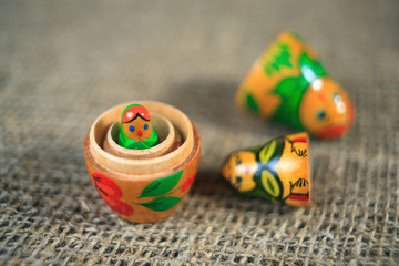 Russian dolls. Matryoshka on linen fabric for the background.
