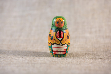 Russian dolls. Matryoshka on linen fabric for the background.